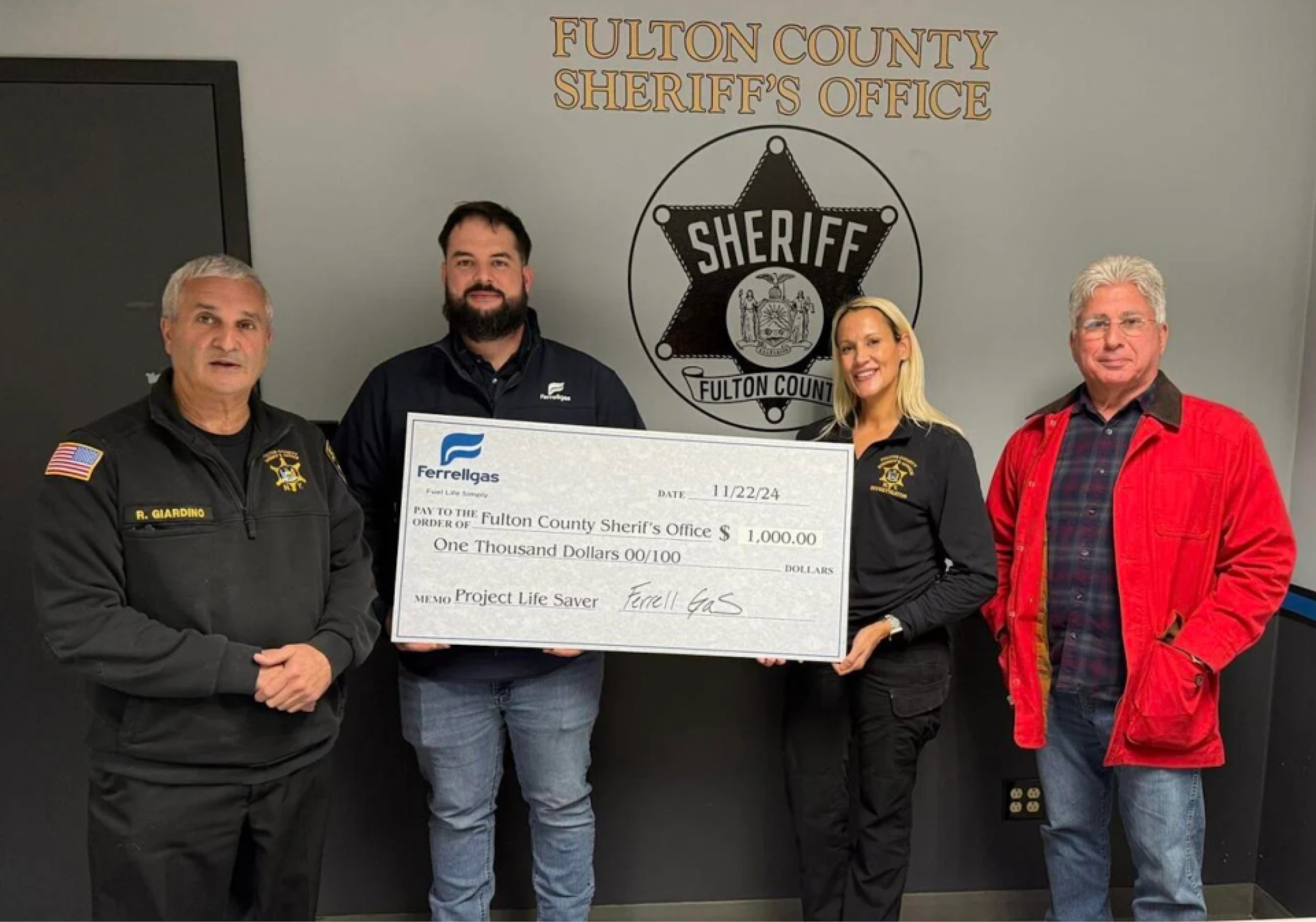 Ferrellgas employees presenting a check in support of the Fulton County Sheriff’s Project Lifesaver program.