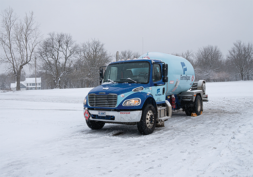 Ferrellgas delivery truck parked in a snow-covered driveway.