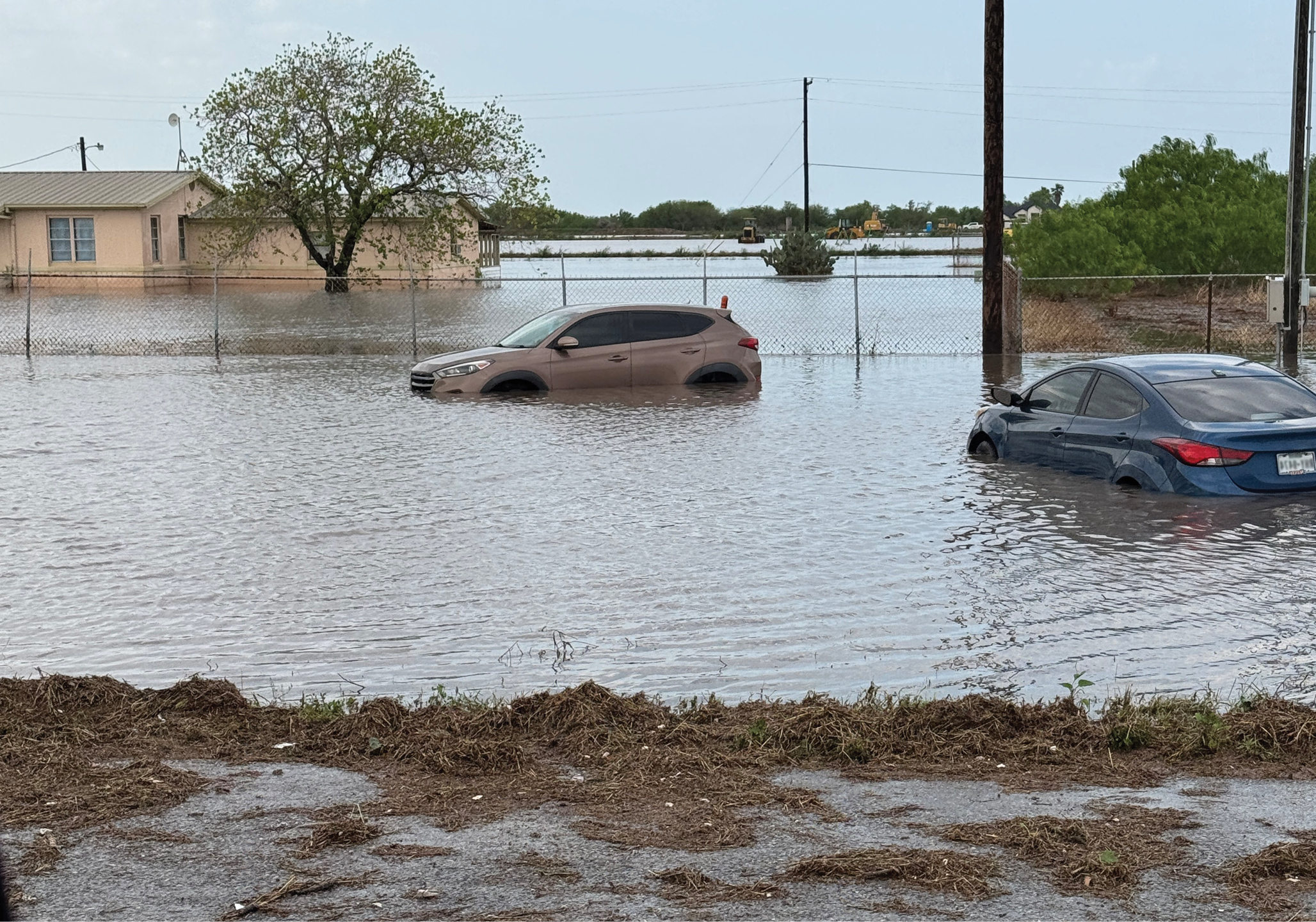 Cars and homes surrounded by water after flooding in Globe, Arizona.
