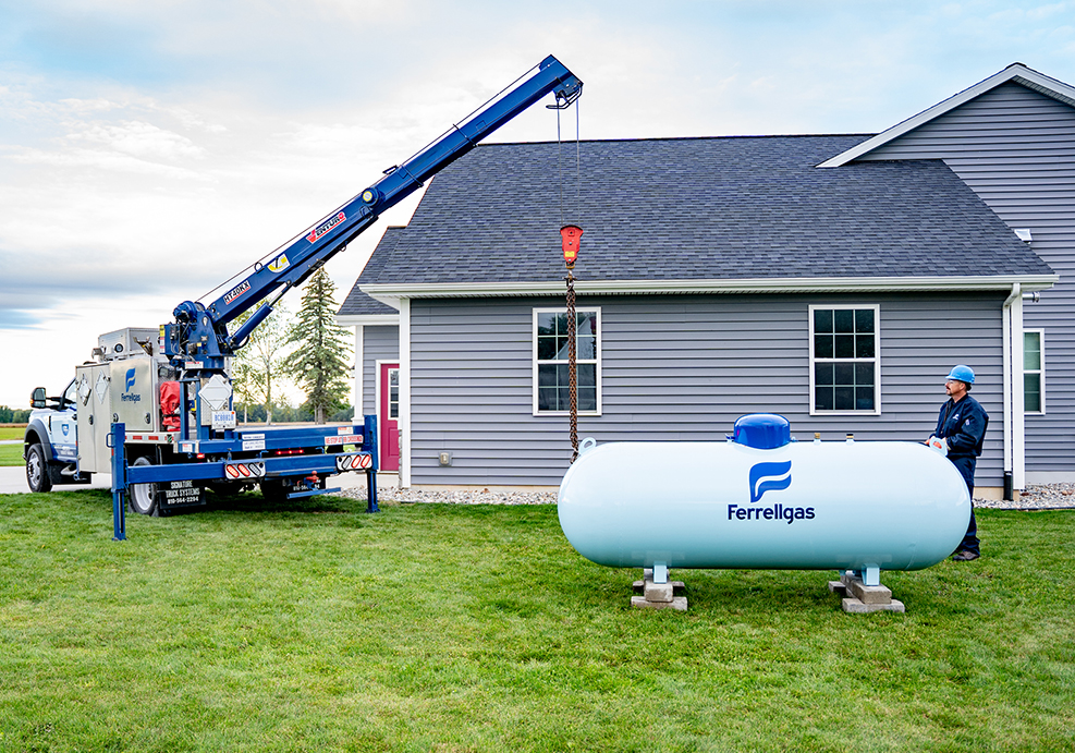 A Ferrellgas Service Technician demonstrates safe installation of a new residential propane tank.