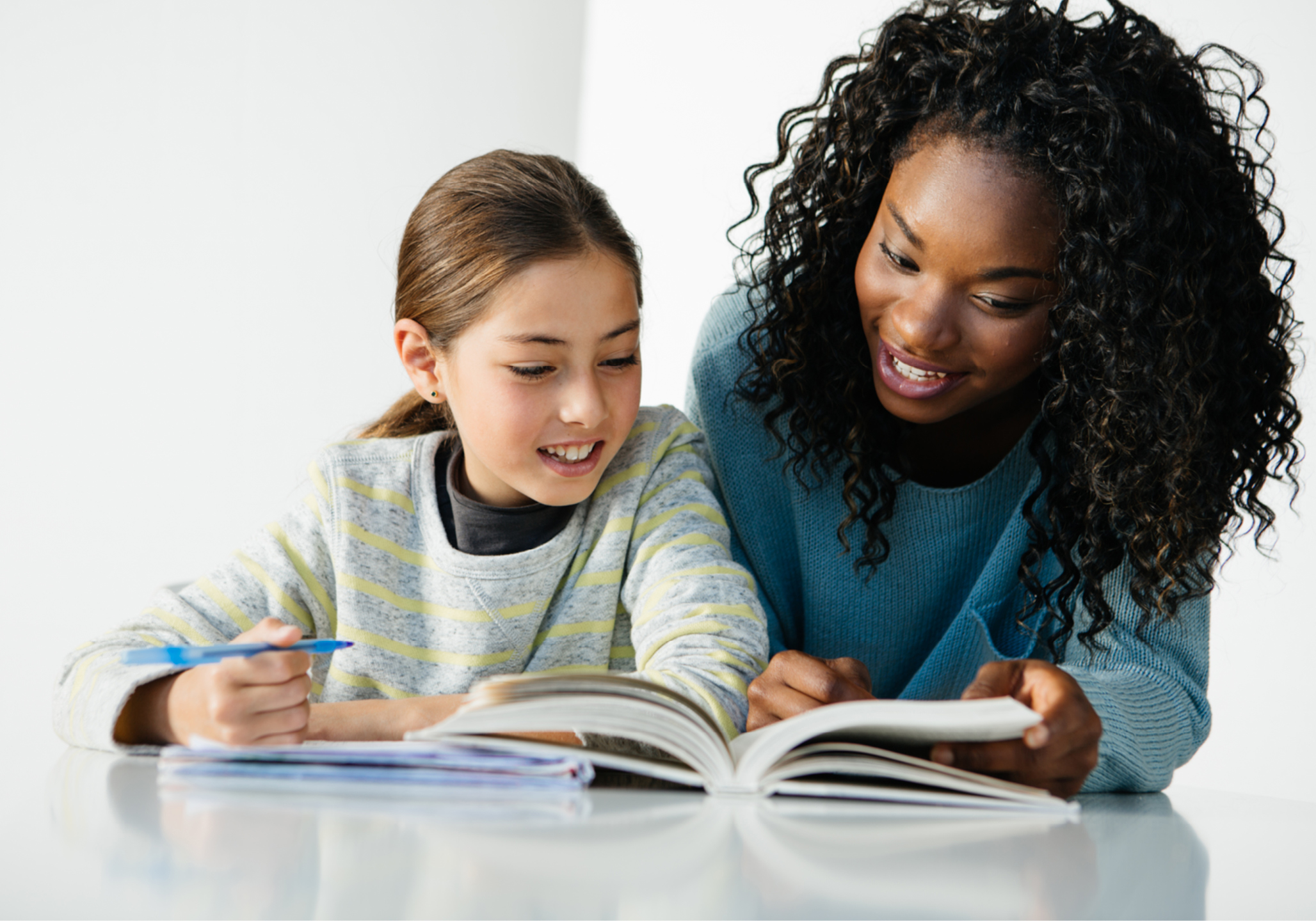 Women reading to a child.