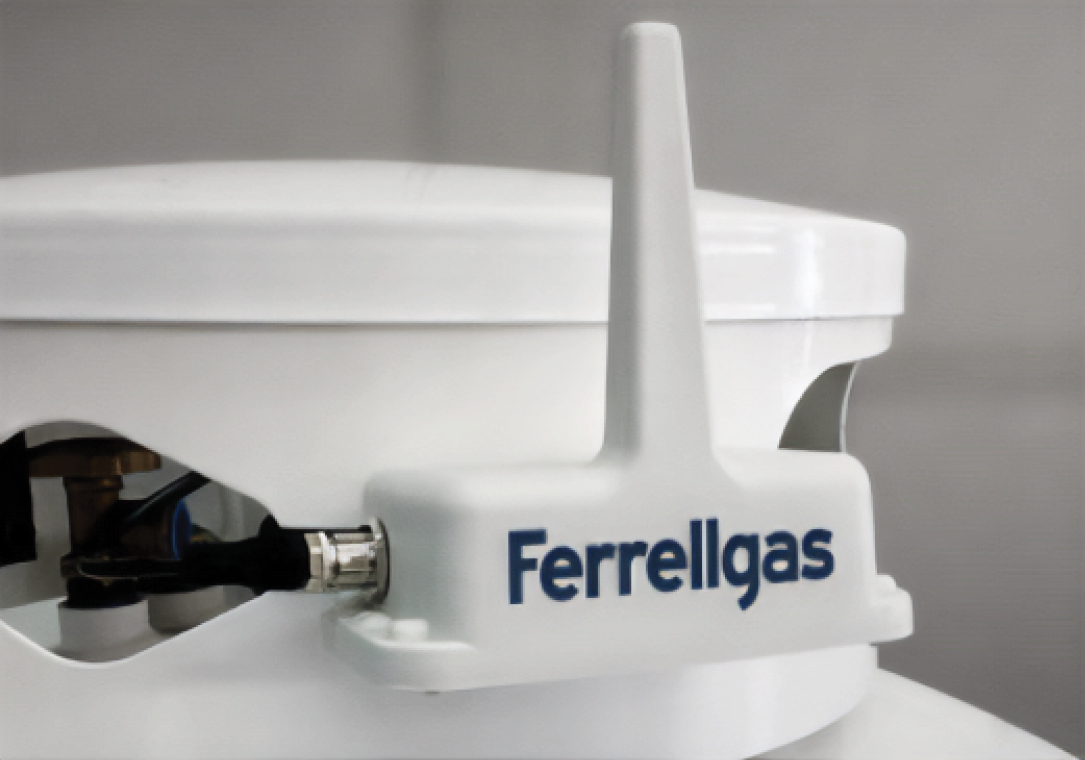 Close-up of a Ferrellgas propane tank dome with a remote tank monitor installed.