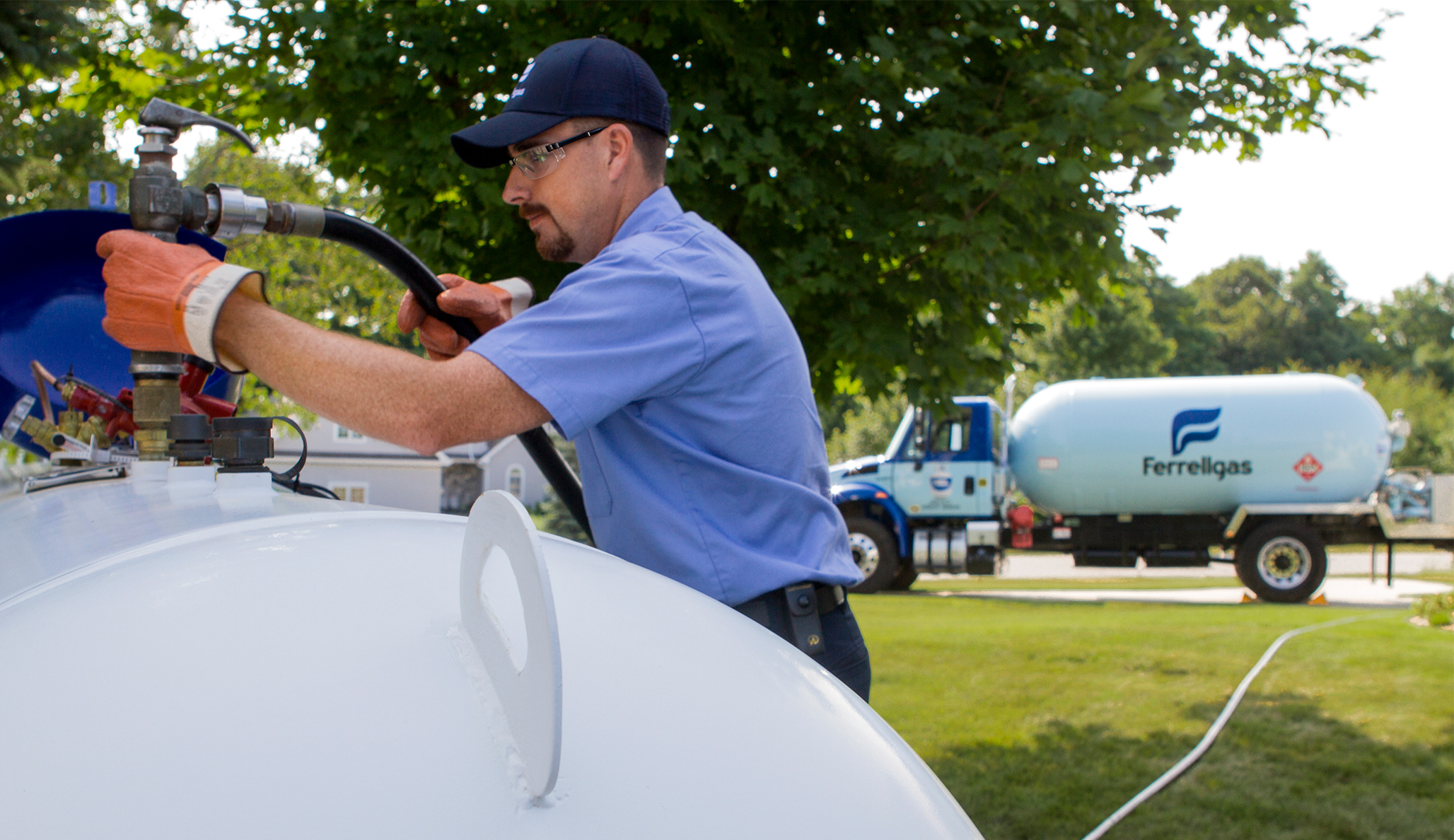 Ferrellgas Delivery Driver filling a residential propane tank.